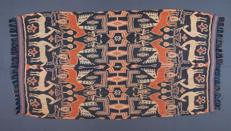 Sumba hinggi cloth with horse motifs and geometric borders in indigo and morinda dye.
