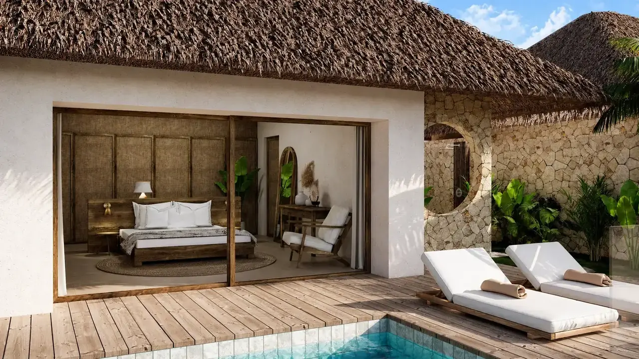 La chambre d'une villa Kabisu ouverte sur sa terrasse et sa piscine
