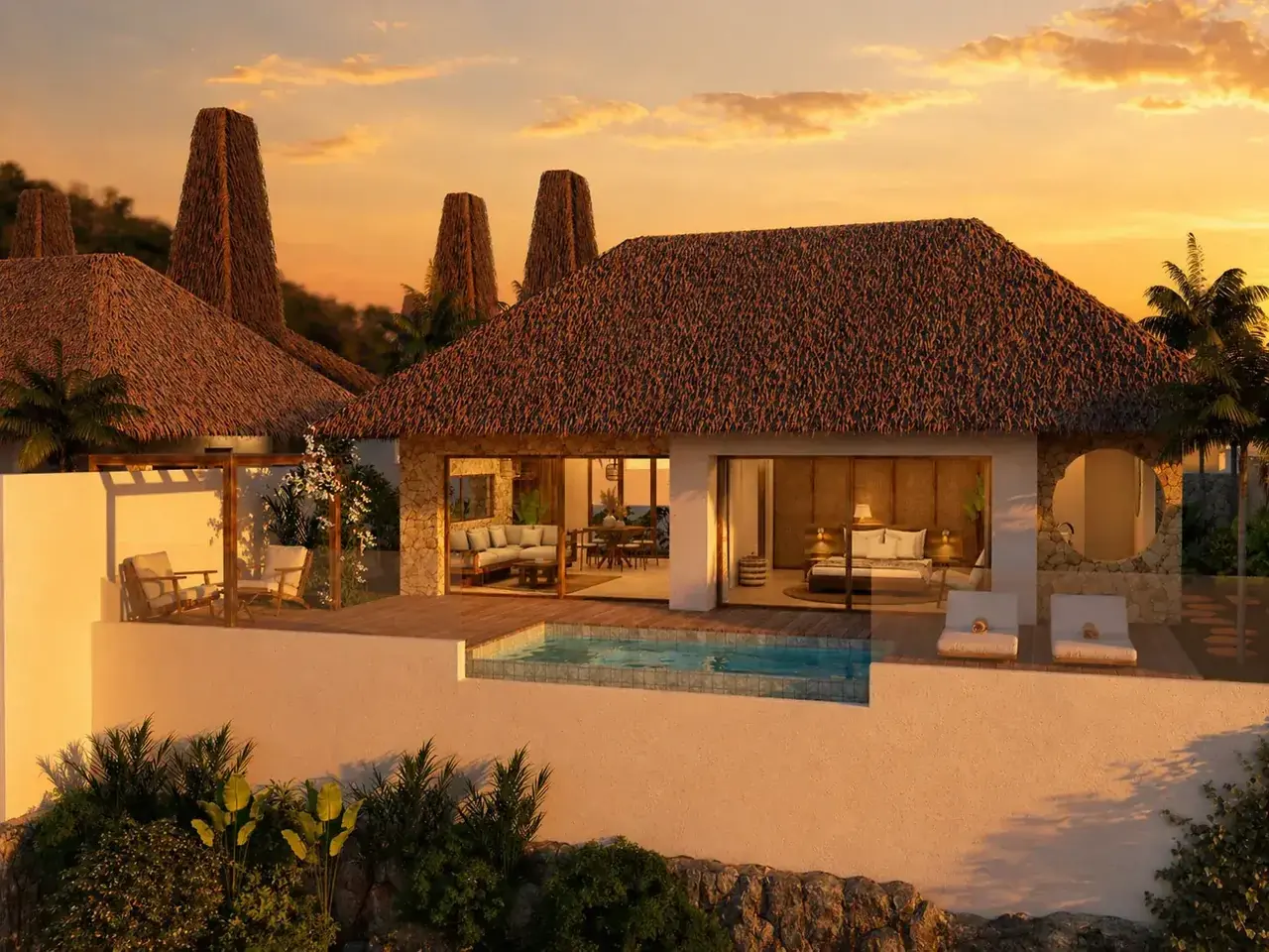 A Kabisu villa at sunset, living room and bedroom opening onto the pool